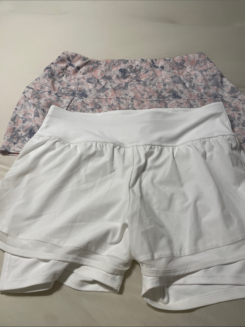 Women’s White Athletic Shorts and pink floral both size Large. Never worn.